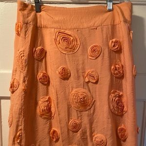 Beautiful peach colored skirt with fabric roses